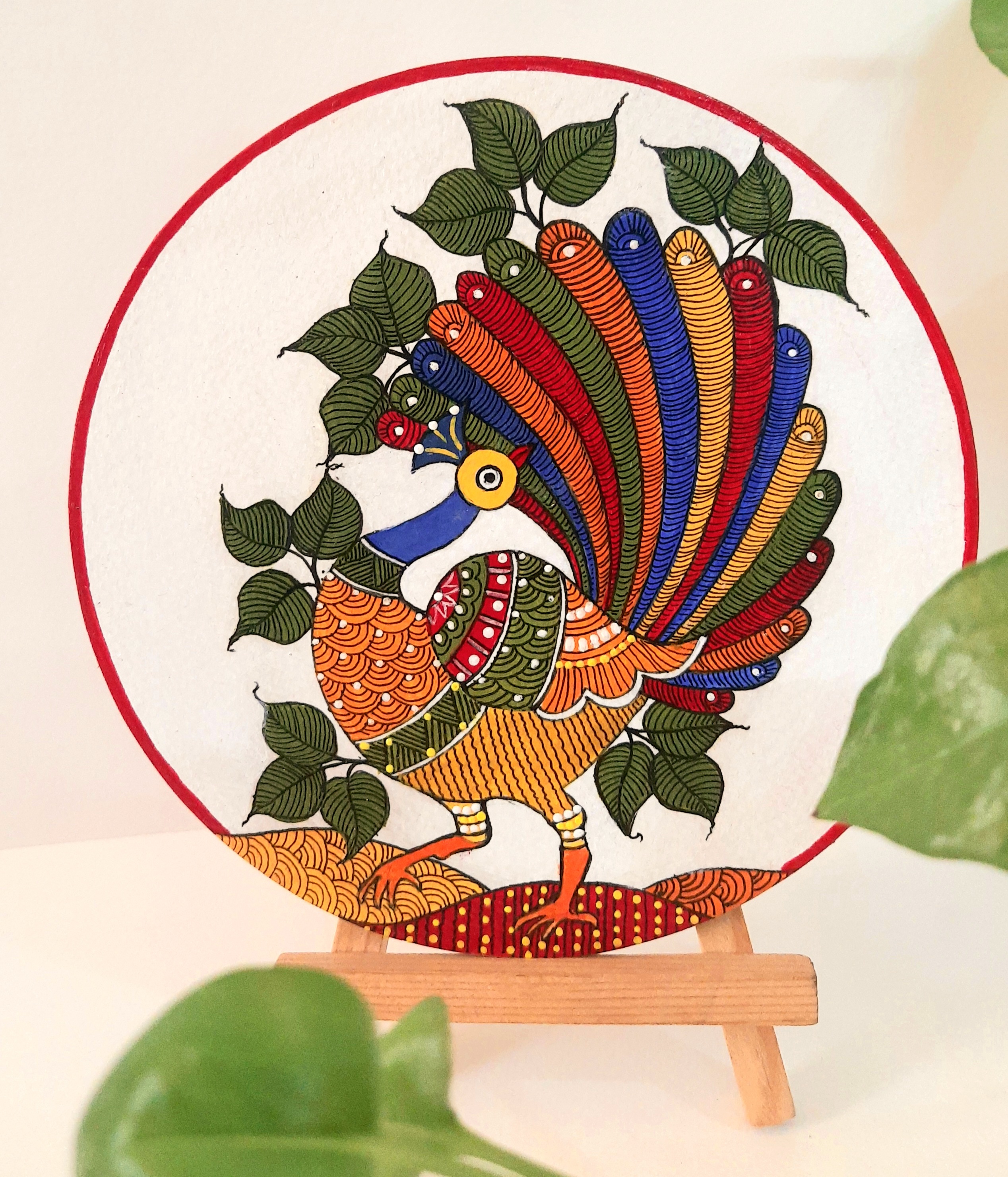 Gond painting of peacock on 6inch round mdf board with wooden stand