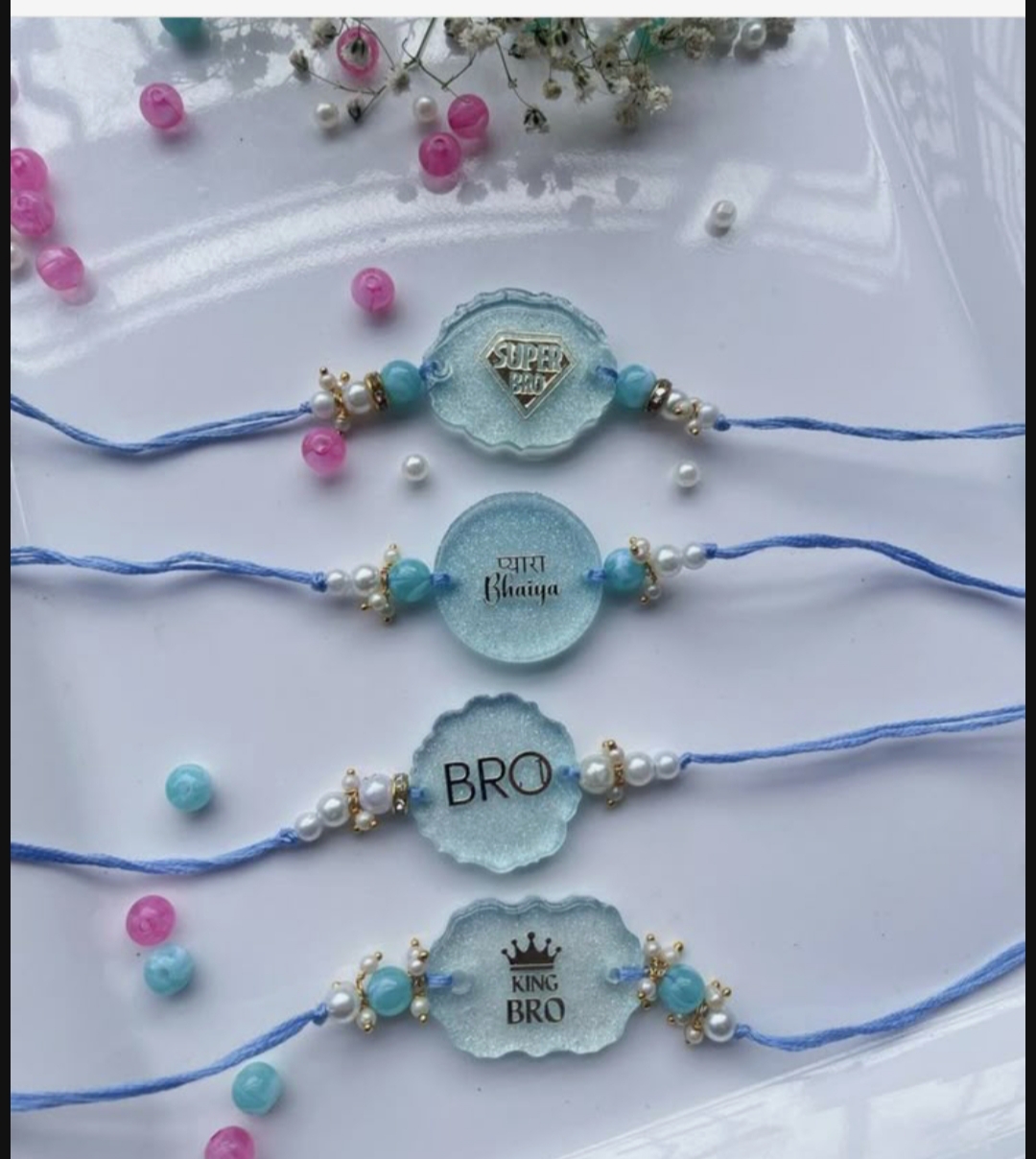 Custom DIY resin Rakhi with acrylic cutouts and elegant ribbons for Raksha Bandhan.
