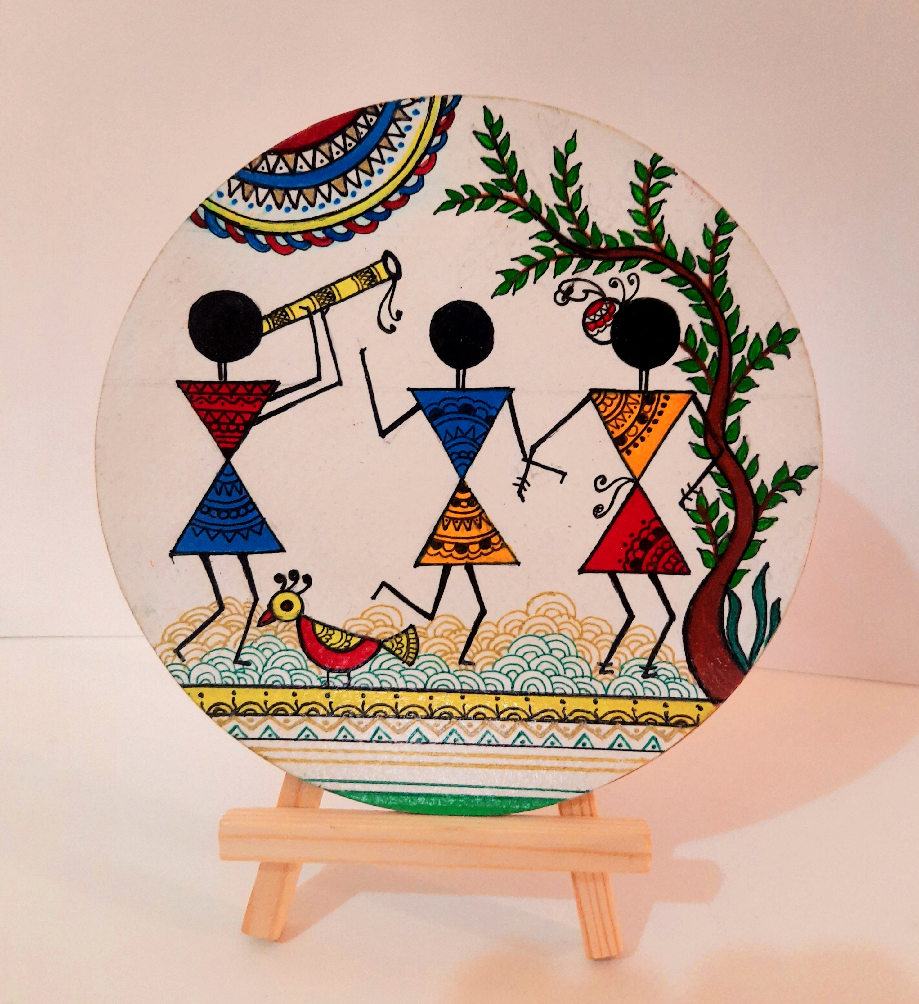 warli-painting-of-three-figures-on-6inch-round-mdf-board-with-stand-2-0_1734114137.jpg